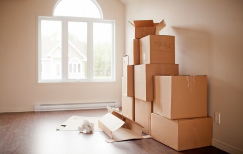 Professional packers organising household items room by room in Fulham