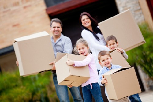 Packed boxes and moving equipment ready for a local removal service in Fulham