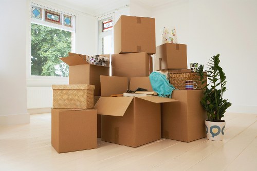Professional movers unloading belongings at a Fulham property