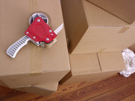 Professional movers unloading office or home items during a same-day relocation in Fulham